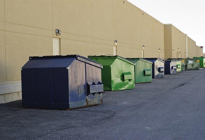 a stack of heavy construction dumpsters waiting to be emptied in Aplington, IA